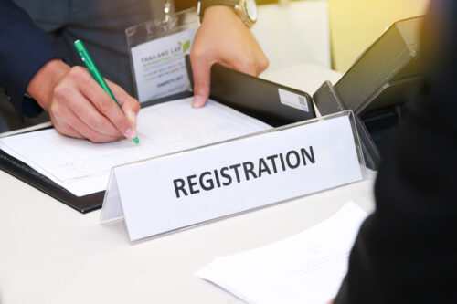 close-up of registration desk in front of conference center with